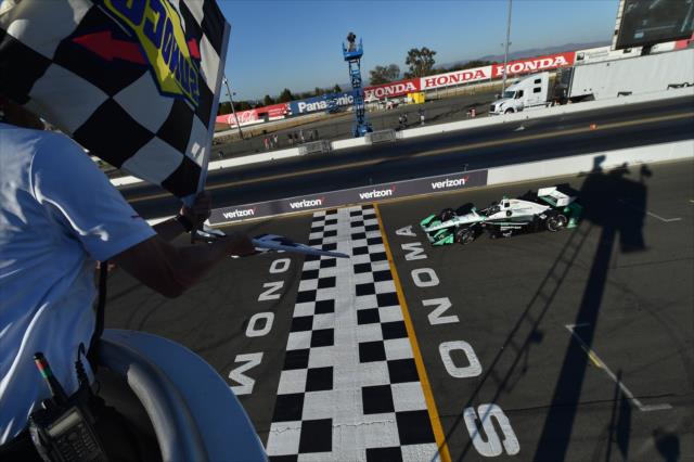 Simon Pagenaud receives the twin checkers to win the GoPro Grand Prix of Sonoma becoming the 2016 Verizon IndyCar Series Champion -- Photo by: Chris Owens