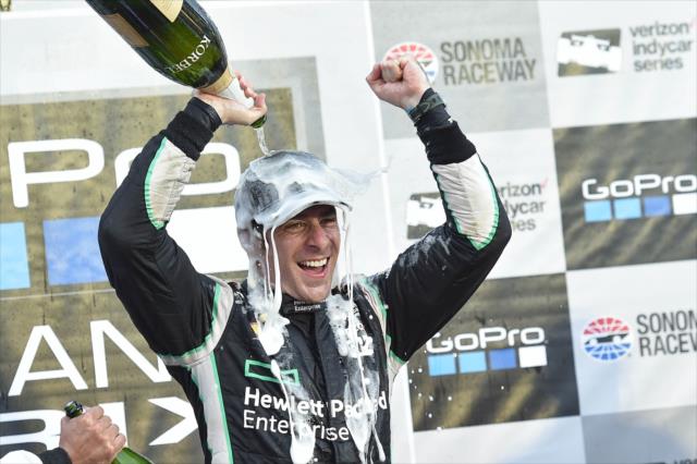 Simon Pagenaud with a champagne shower in Victory Lane following his win in the GoPro Grand Prix of Sonoma to become the 2016 Verizon IndyCar Series Champion -- Photo by: Chris Owens