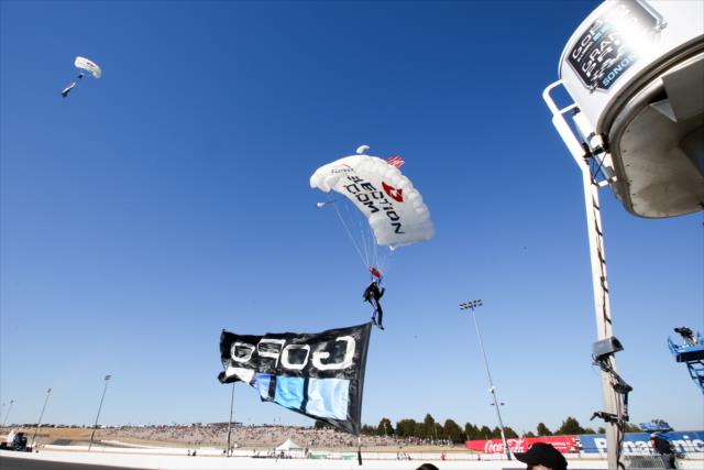Skydivers come in for a landing during pre-race festivities for the GoPro Grand Prix of Sonoma -- Photo by: Joe Skibinski