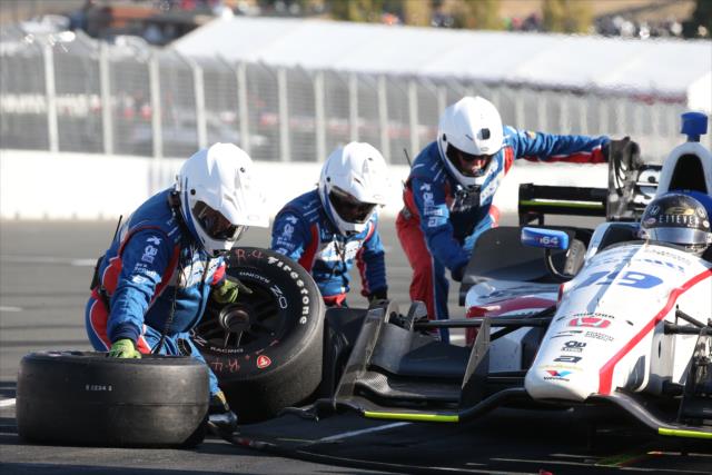 The Dale Coyne Racing crew go to work on the car of Ed Jones on pit lane  during the GoPro Grand Prix of Sonoma -- Photo by: Chris Jones