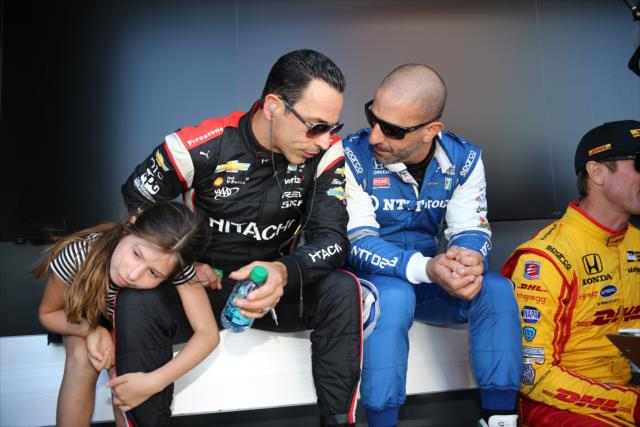 Tony Kanaan and Helio Castroneves chat backstage during pre-race introductions for the GoPro Grand Prix of Sonoma -- Photo by: Chris Jones