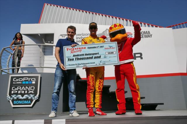 Ryan Hunter-Reay accepts the Firestone Pit Stop Performance Award on behalf of Andretti Autosport for their performance at Watkins Glen -- Photo by: Chris Jones
