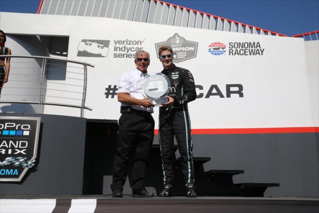 Josef Newgarden accepts the Verizon P1 Award for winning the pole position for the GoPro Grand Prix of Sonoma -- Photo by: Chris Jones