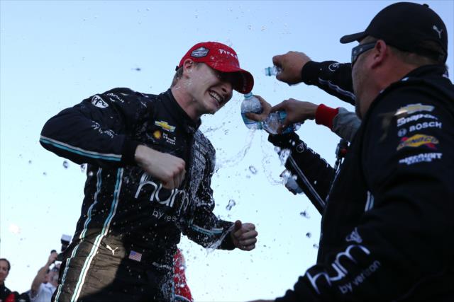Josef Newgarden with a cold shower from his crew after winning the 2017 Verizon IndyCar Series championship -- Photo by: Chris Jones