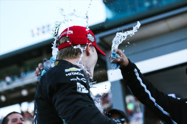 Josef Newgarden with a cold shower from his crew after clinching the 2017 Verizon IndyCar Series championship -- Photo by: Joe Skibinski