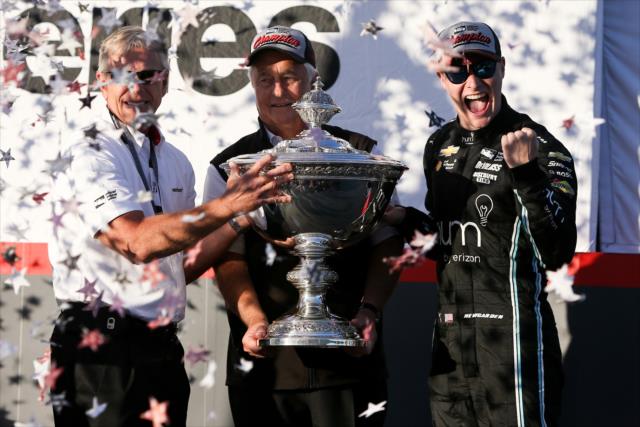 Josef Newgarden and Roger Penske accept the Astor Cup as the 2017 Verizon IndyCar Series champions -- Photo by: Joe Skibinski