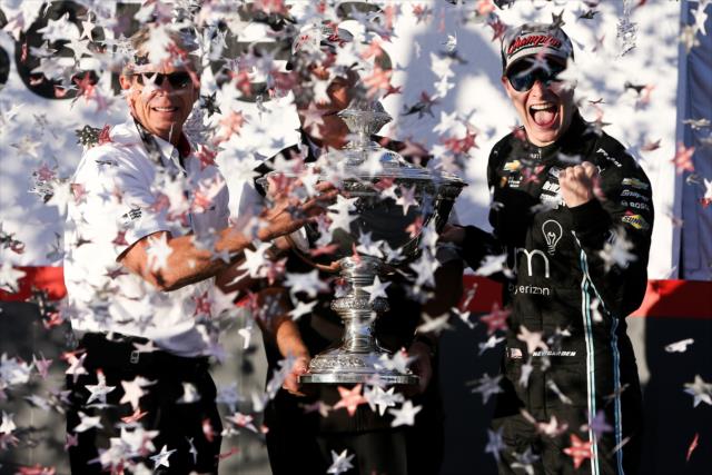 Josef Newgarden celebrates on stage with the Astor Cup as the 2017 Verizon IndyCar Series champion at Sonoma Raceway -- Photo by: Joe Skibinski