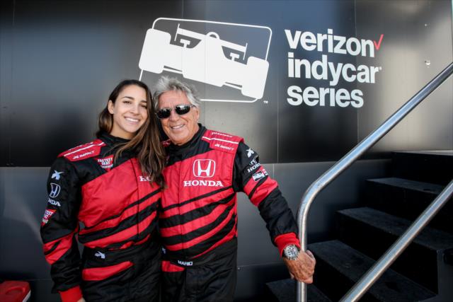 Mario Andretti and gymnast Aly Raisman pose backstage during pre-race introductions for the GoPro Grand Prix of Sonoma -- Photo by: Joe Skibinski
