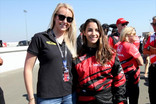 USF2000 driver Ayla Agren poses with gymnast Aly Raisman along pit lane during pre-race festivities for the GoPro Grand Prix of Sonoma -- Photo by: Joe Skibinski