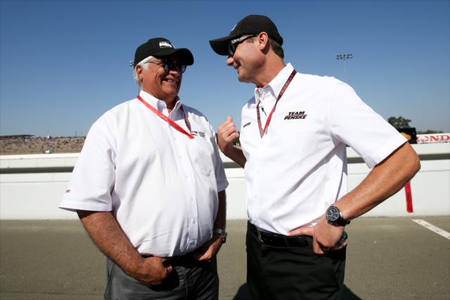 INDYCAR CEO Mark Miles chats with Team Penske president Tim Cindric along pit lane during pre-race festivities for the GoPro Grand Prix of Sonoma -- Photo by: Joe Skibinski