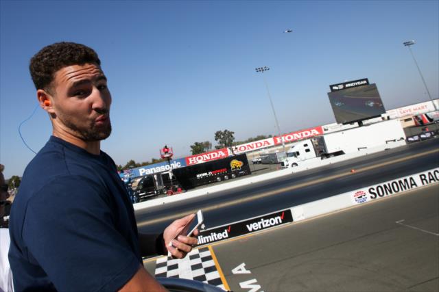 Golden State Warriors guard Klay Thompson is ready to waive the green flag to start the GoPro Grand Prix of Sonoma -- Photo by: Joe Skibinski