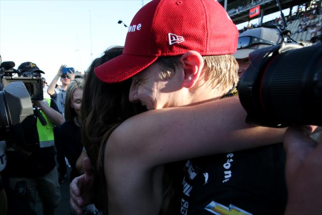 Josef Newgarden gets a hug from his girlfriend, Ashley, after winning the 2017 Verizon IndyCar Series championship -- Photo by: Joe Skibinski