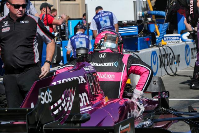 Jack Harvey slides into his No. 7 AutoNation Honda on pit lane prior to the final warmup for the GoPro Grand Prix of Sonoma at Sonoma Raceway -- Photo by: Richard Dowdy