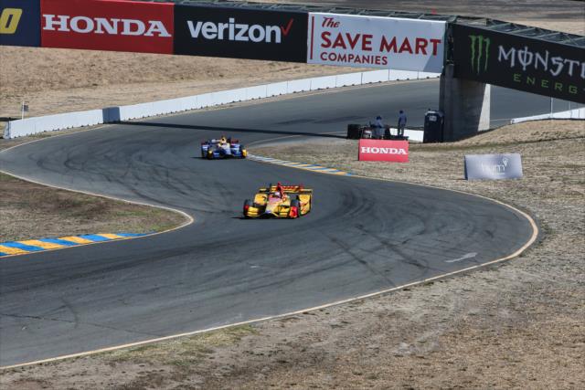 Ryan Hunter-Reay and Alexander Rossi race up the hill into Turn 2 during the final warmup for the GoPro Grand Prix of Sonoma -- Photo by: Richard Dowdy