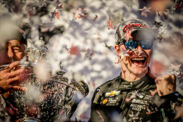 Josef Newgarden receives the Astor Cup on stage as the 2017 Verizon IndyCar Series champion -- Photo by: Shawn Gritzmacher
