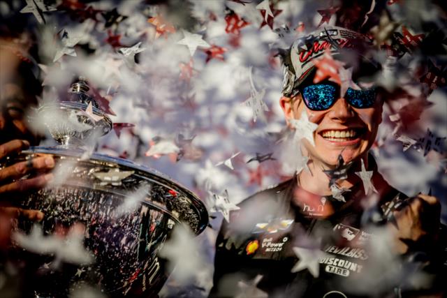 Josef Newgarden celebrates on stage with the Astor Cup as the 2017 Verizon IndyCar Series champion -- Photo by: Shawn Gritzmacher