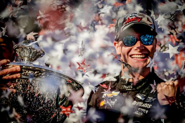 Josef Newgarden celebrates on stage as the 2017 Verizon IndyCar Series champion -- Photo by: Shawn Gritzmacher