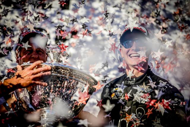 Josef Newgarden celebrates on stage with the Astor Cup as the 2017 Verizon IndyCar Series champion -- Photo by: Shawn Gritzmacher