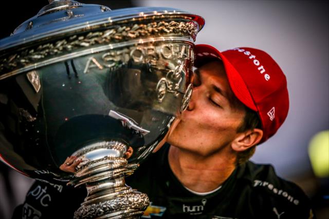Josef Newgarden kisses the Astor Cup as the 2017 Verizon IndyCar Series champion -- Photo by: Shawn Gritzmacher