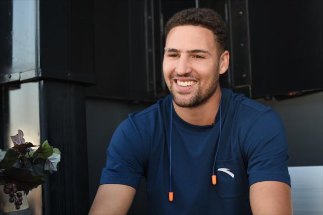 Golden State Warriors guard Klay Thompson relaxes backstage during pre-race festivities for the GoPro Grand Prix of Sonoma at Sonoma Raceway -- Photo by: Chris Owens