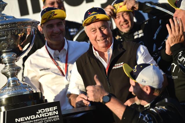 Roger Penske, Tim Cindric, and the entire Team Penske team celebrate on stage as the 2017 Verizon IndyCar Series champions -- Photo by: Chris Owens