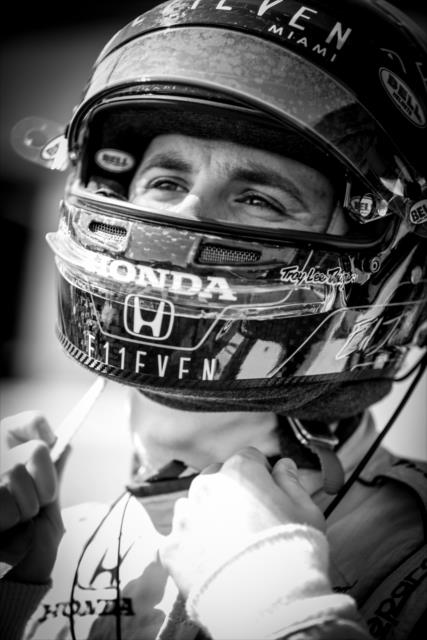 Ed Jones straps on his helmet along pit lane prior to the GoPro Grand Prix of Sonoma -- Photo by: Shawn Gritzmacher