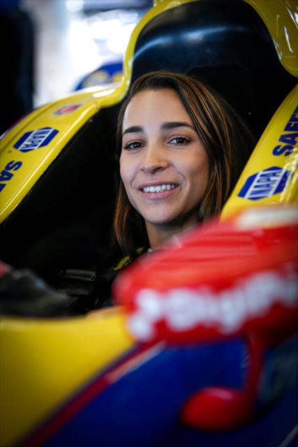 Olympic gymnast Aly Raisman sits in the No. 98 NAPA Auto Parts Honda of Alexander Rossi in the Andretti Autosport garages at Sonoma Raceway -- Photo by: Shawn Gritzmacher