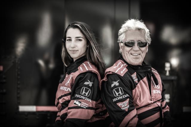 Olympic gymnast Aly Raisman poses with Indy car legend Mario Andretti prior to her two-seater ride at Sonoma Raceway -- Photo by: Shawn Gritzmacher