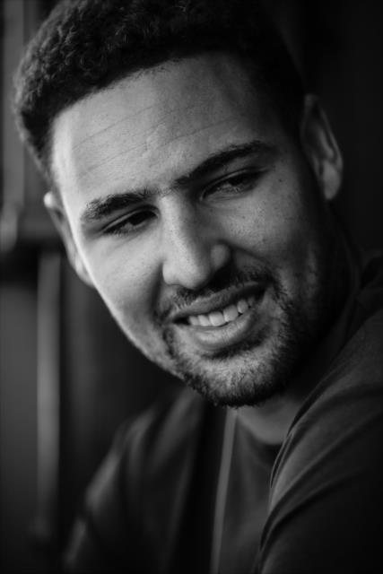 Golden State Warriors guard Klay Thompson relaxes backstage during pre-race festivities for the GoPro Grand Prix of Sonoma -- Photo by: Shawn Gritzmacher