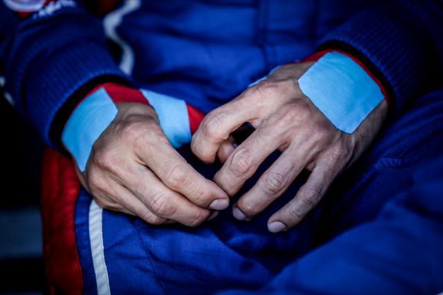 The hands of Scott Dixon ready to do battle during pre-race introductions for the GoPro Grand Prix of Sonoma at Sonoma Raceway -- Photo by: Shawn Gritzmacher