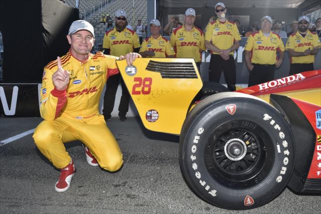Ryan Hunter-Reay affixes the Verizon P1 Award emblem to his car after winning the pole position for the INDYCAR Grand Prix of Sonoma at Sonoma Raceway -- Photo by: Chris Owens