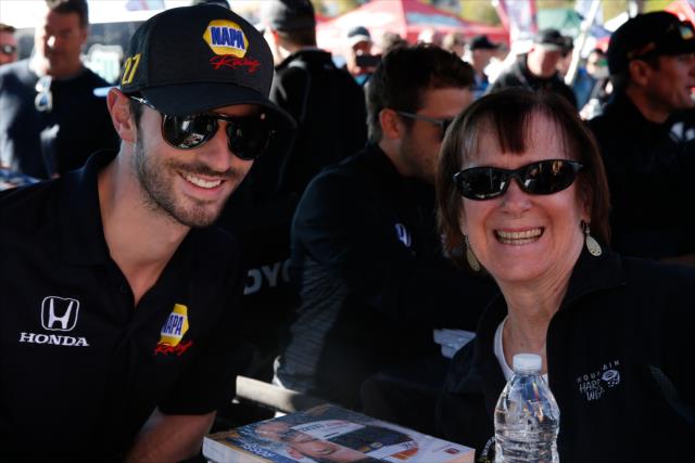 Alexander Rossi poses for a photograph during the autograph session in the INDYCAR Fan Village at Sonoma Raceway -- Photo by: Joe Skibinski