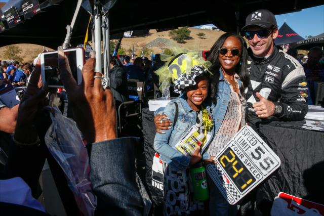 Simon Pagenaud poses for a photograph during the autograph session in the INDYCAR Fan Village at Sonoma Raceway -- Photo by: Joe Skibinski