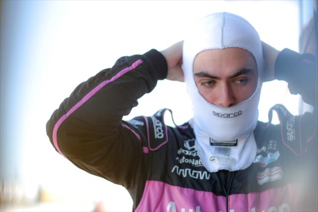 Jack Harvey slides on his balaclava on pit lane prior to qualifications for the INDYCAR Grand Prix of Sonoma at Sonoma Raceway -- Photo by: Shawn Gritzmacher