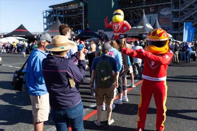 The Firestone Firehawk jokes around with a few fans during the autograph session in the INDYCAR Fan Village at Sonoma Raceway -- Photo by: Stephen King