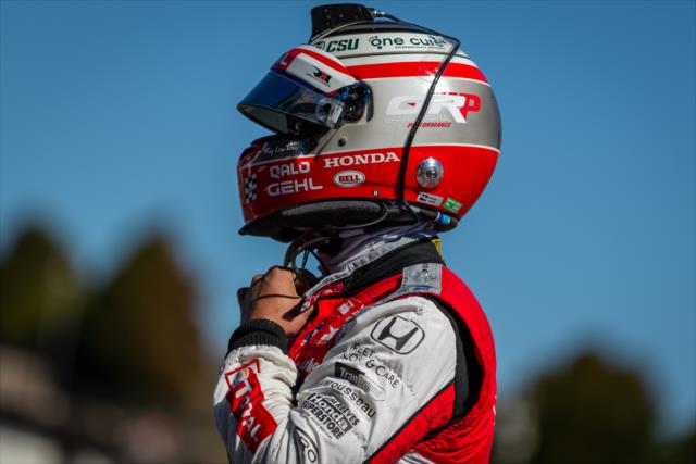 Graham Rahal straps on his helmet along pit lane prior to practice for the INDYCAR Grand Prix of Sonoma at Sonoma Raceway -- Photo by: Stephen King