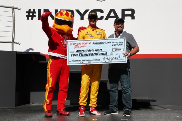 Ryan Hunter-Reay accepts the Firestone Pit Stop Performance award on behalf of Andretti Autosport for their performance in Portland -- Photo by: Chris Jones