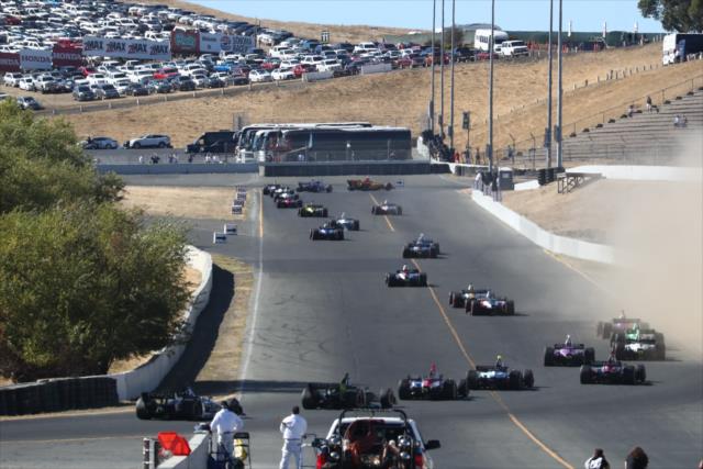The field streams up the hill toward the Turn 7 hairpin during the INDYCAR Grand Prix of Sonoma at Sonoma Raceway -- Photo by: Chris Jones