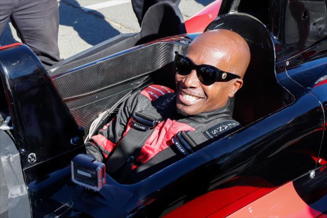 MC Hammer gets strapped into the two-seater prior to his ride with Mario Andretti around Sonoma Raceway -- Photo by: Joe Skibinski