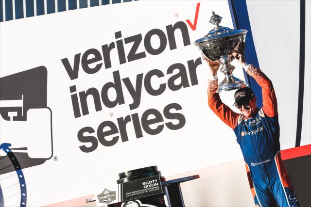 Scott Dixon hoists the Astor Cup on stage after winning the 2018 Verizon IndyCar Series championship at Sonoma Raceway -- Photo by: Joe Skibinski