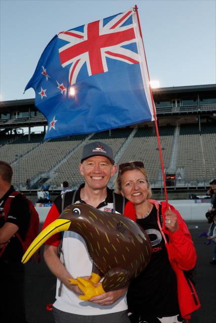 Fans sport the flag of New Zealand and a Kiwi during the championship celebration for Scott Dixon at Sonoma Raceway -- Photo by: Joe Skibinski