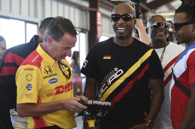 MC Hammer is shown a modern-day INDYCAR steering wheel in the Andretti Autosport garages at Sonoma Raceway -- Photo by: Chris Owens