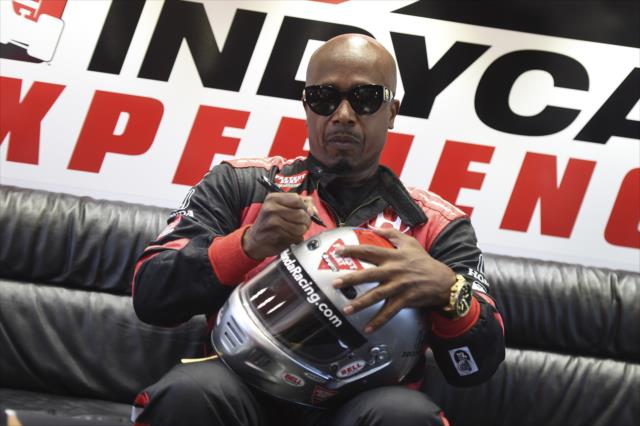 MC Hammer signs the helmet of Mario Andretti prior to their two-seater ride around Sonoma Raceway -- Photo by: Chris Owens