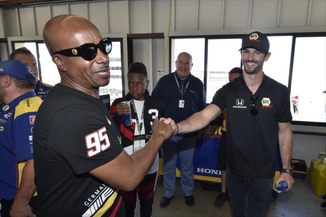 Alexander Rossi greets Grand Marshal MC Hammer in the Andretti Autosport garages at Sonoma Raceway -- Photo by: Chris Owens