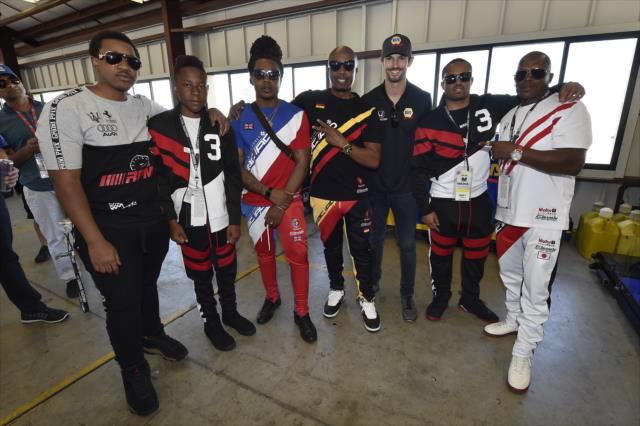 Alexander Rossi with Grand Marshal MC Hammer and his entourage in the Andretti Autosport garages at Sonoma Raceway -- Photo by: Chris Owens