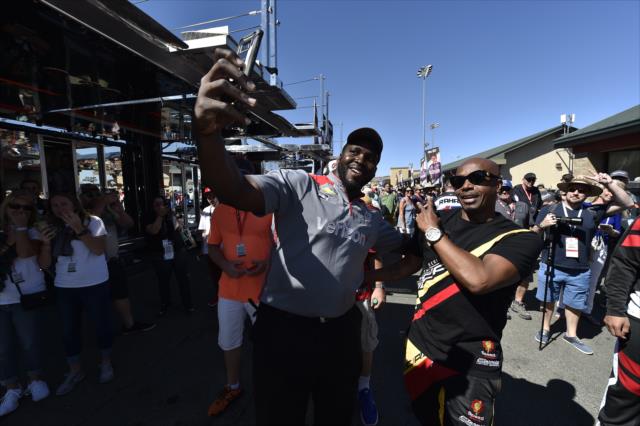 MC Hammer takes a selfie with Team Penske's Quinton Washington in the paddock at Sonoma Raceway -- Photo by: Chris Owens