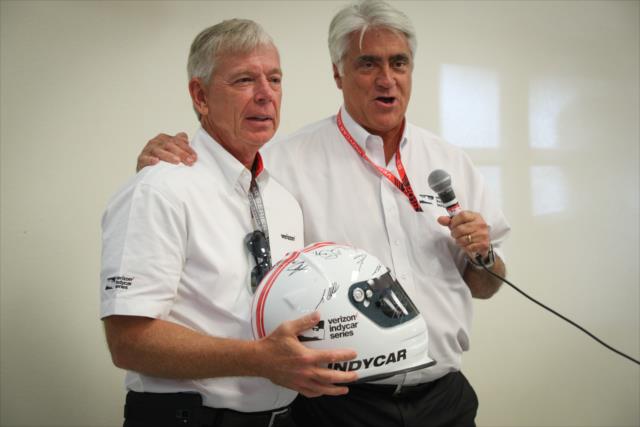 Verizon Executive Chairman Lowell McAdam is presented a signed helmet by INDYCAR CEO Mark Miles during a special presentation at Sonoma Raceway -- Photo by: Shawn Gritzmacher