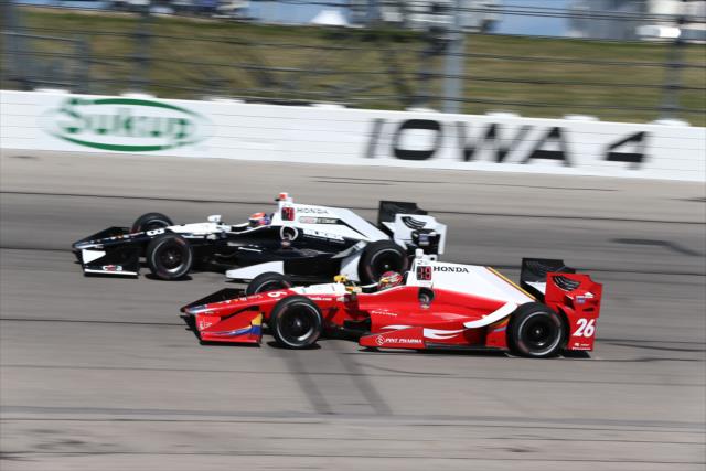 Teammates Alexander Rossi and Carlos Munoz enter Turn 4 during practice for the Iowa Corn 300 at Iowa Speedway -- Photo by: Chris Jones