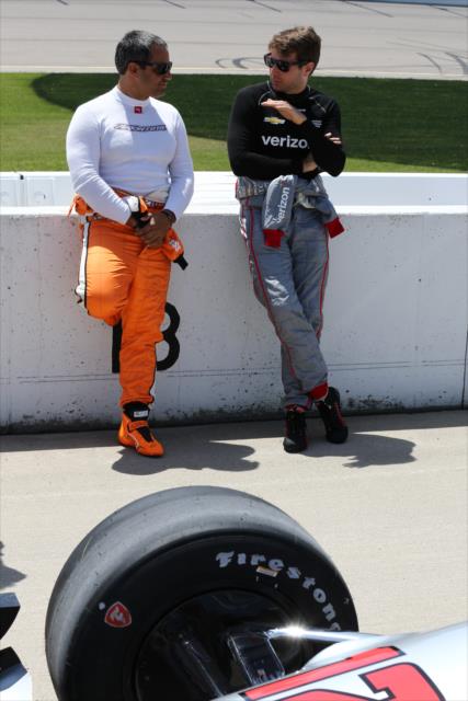 Teammates Juan Pablo Montoya and Will Power chat along pit lane prior to qualifications for the Iowa Corn 300 at Iowa Speedway -- Photo by: Chris Jones
