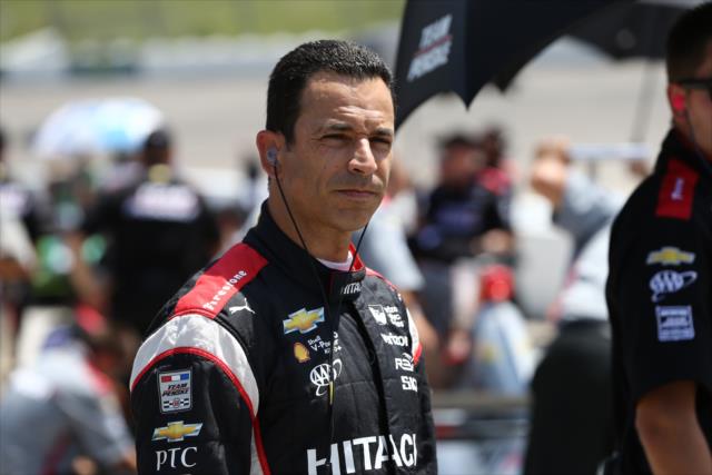 Helio Castroneves waits along pit lane prior to his qualification attempt for the Iowa Corn 300 at Iowa Speedway -- Photo by: Chris Jones
